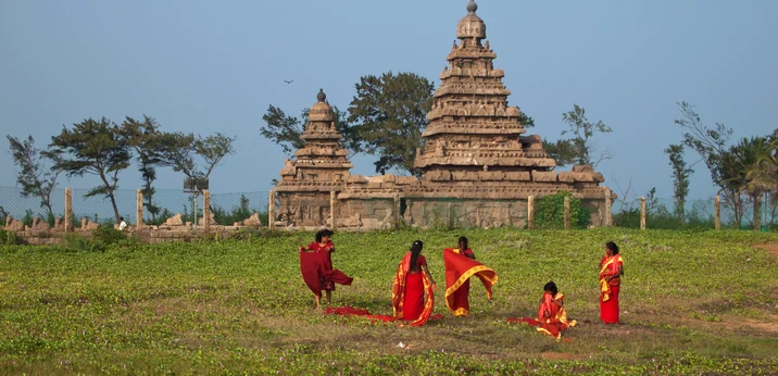 Visitors on the lawn before the Shore Temple at Mahabalipuram